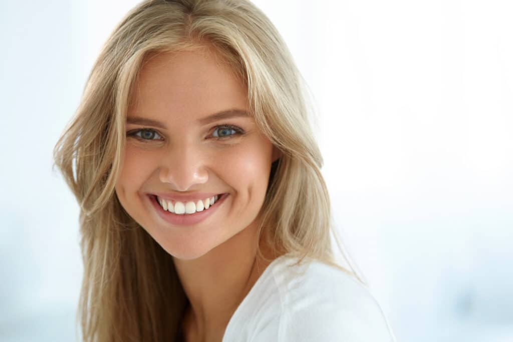 Beauty Woman Portrait. Girl With Beautiful Face Smiling